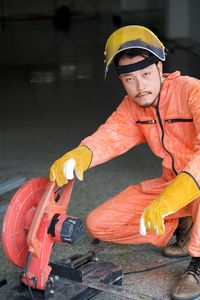 Midsection of man holding umbrella
