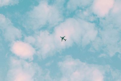 Low angle view of airplane flying in sky