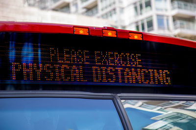 Low angle view of text on glass