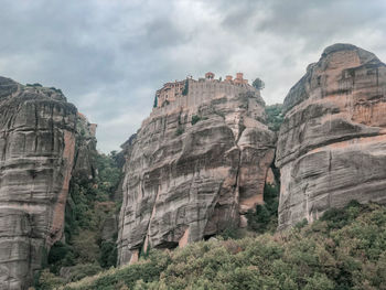 Low angle view of rock formations against sky