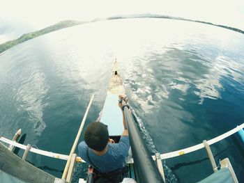 High angle view of man fishing in sea