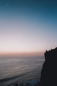 Scenic view of sea against clear sky during sunset