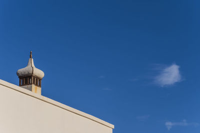 Low angle view of building against blue sky