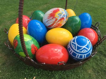 Colorful balls on grassy field