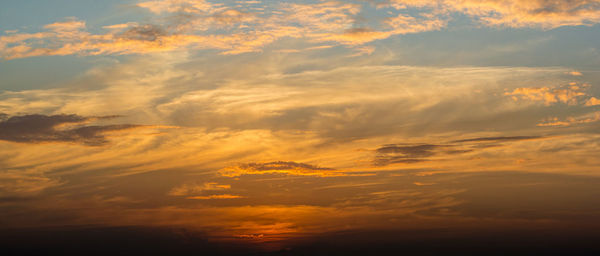 Scenic view of dramatic sky at sunset