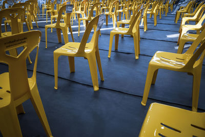 High angle view of empty chairs at table