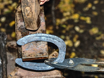 Blacksmith working on anvil, making a horseshoe. traditional blacksmith tool for craft in workshop