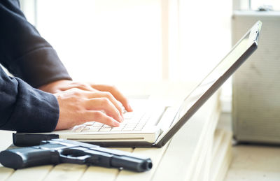 Man using laptop on table