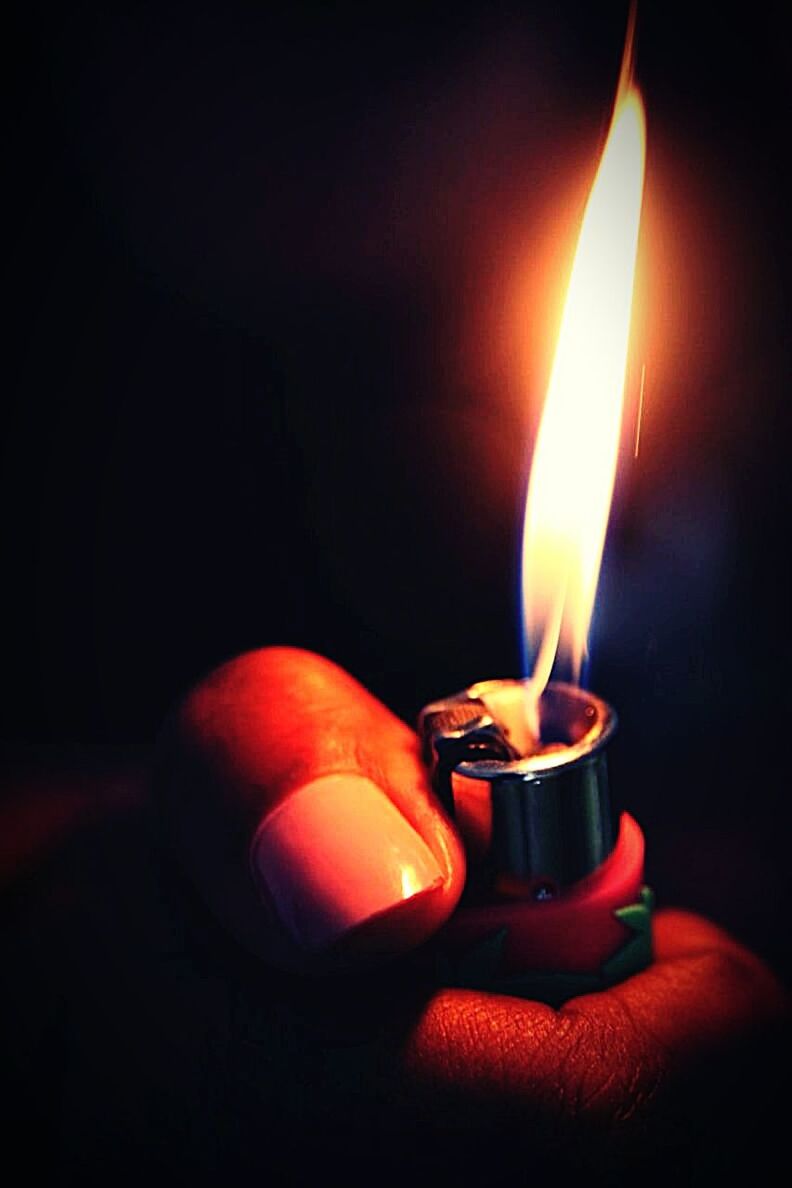 fire, burning, flame, heat - temperature, fire - natural phenomenon, close-up, indoors, human hand, hand, glowing, human body part, holding, dark, cigarette lighter, nature, one person, illuminated, focus on foreground, igniting, studio shot, finger, black background
