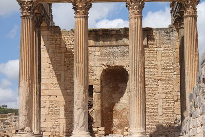 Low angle view of historic temple against sky