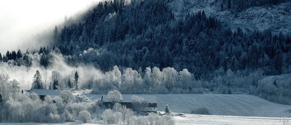 Panoramic shot of frozen lake against sky