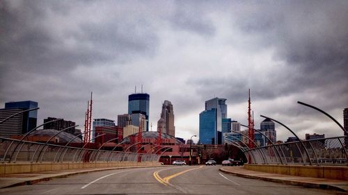 City buildings against cloudy sky