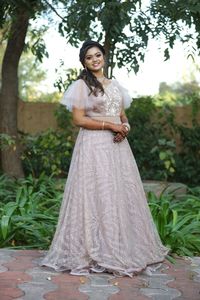 Portrait of a smiling young woman standing outdoors