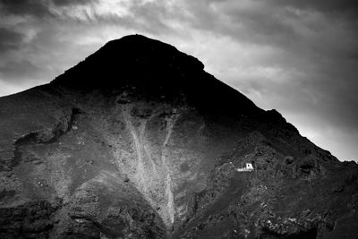 Low angle view of rock formation against sky