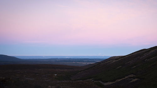 Scenic view of landscape against sky during sunset