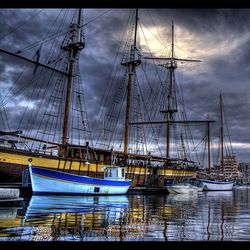 Boats moored at harbor