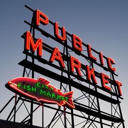 Low angle view of information sign at night