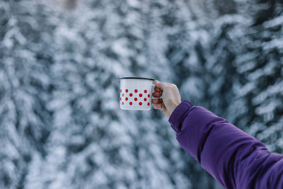 Cropped hand of woman holding gift