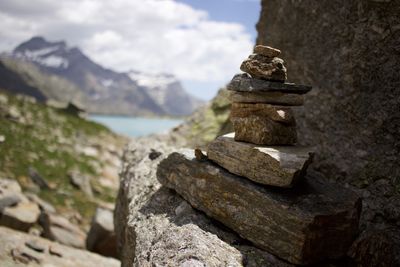 Close-up of stack of rocks against sky