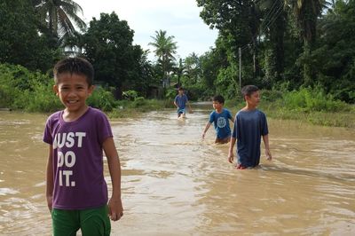 Boy standing in water