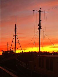 Silhouette of sailboat against sky during sunset