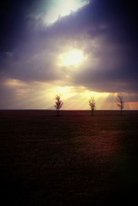 Scenic view of landscape against cloudy sky