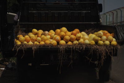 Fruits in basket for sale at market stall