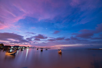 Scenic view of sea against sky at sunset