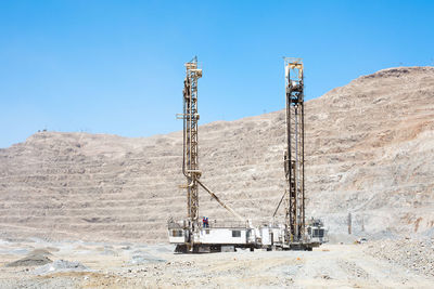 Blasthole drill in an open pit copper mine operation in chile