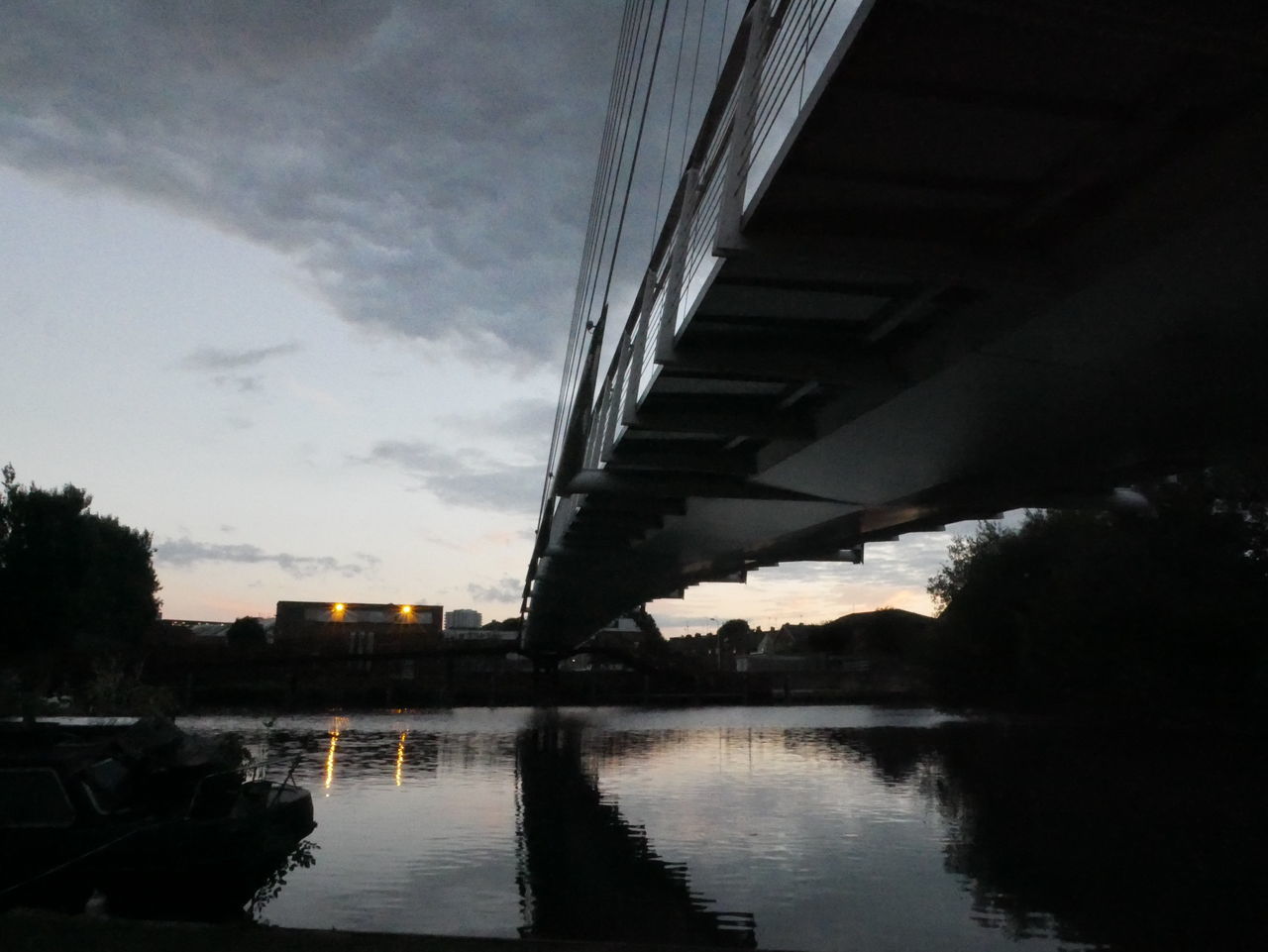 VIEW OF BRIDGE OVER RIVER AGAINST SKY