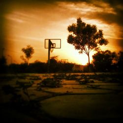 Scenic view of landscape against sky at sunset