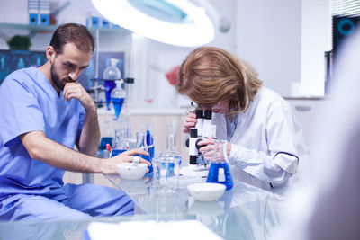 Female friends working in laboratory