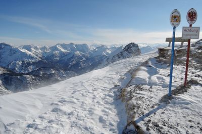 Snow covered landscape against the sky