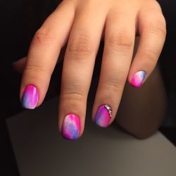 Close-up of woman hand on pink flowers