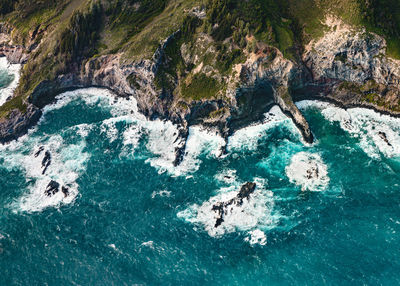 High angle view of rock formation in sea