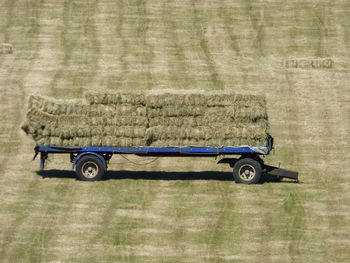 Side view of trailer parked on field