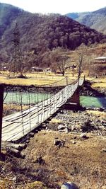 Scenic view of river against mountain range