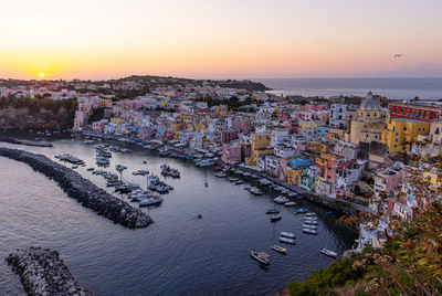High angle view of city at sunset