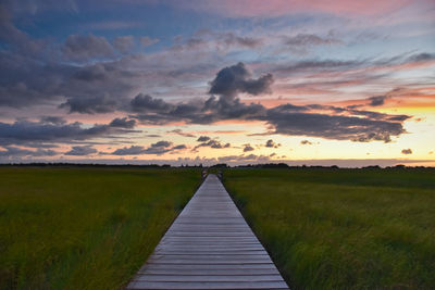 Scenic view of field against sky during sunset