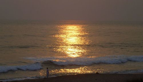 Close-up of sea against sky at sunset