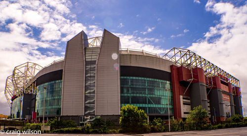 Low angle view of office building against sky