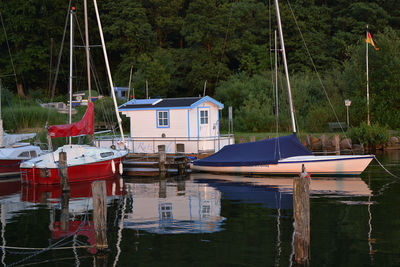 Boats moored at harbor