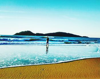 Scenic view of sea against clear blue sky