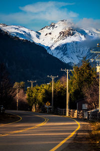 Road against snowcapped mountains