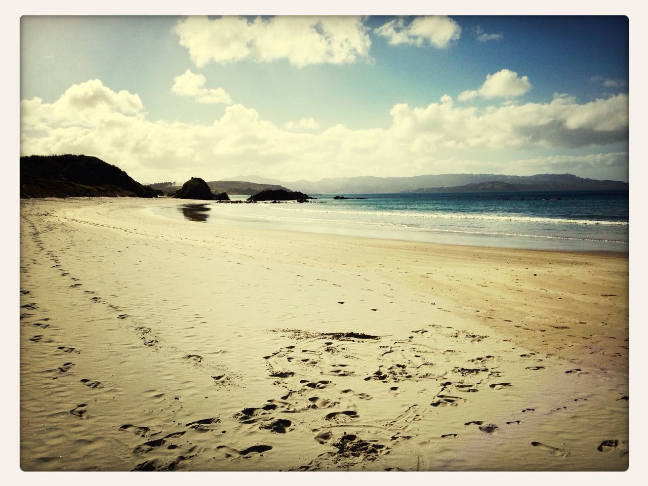 transfer print, beach, sky, water, sea, sand, auto post production filter, shore, tranquil scene, tranquility, scenics, beauty in nature, cloud - sky, nature, cloud, coastline, horizon over water, day, cloudy, outdoors