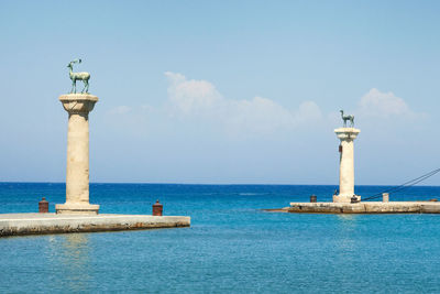 Deer statues at the entrance to mandraki harbour, rhodes island, greece