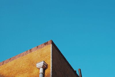 Low angle view of building against blue sky