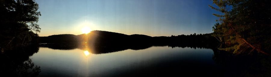 Scenic view of lake at sunset