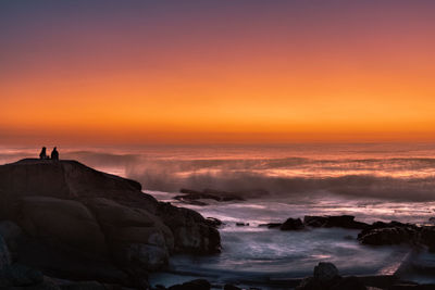 Scenic view of sea against sky during sunset,