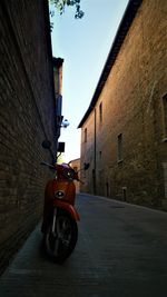 Car on street amidst buildings